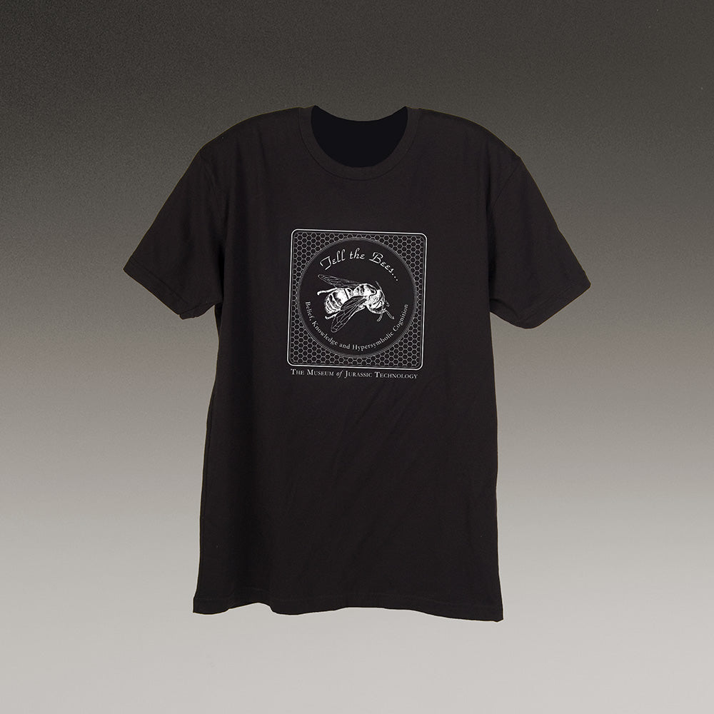Black t-shirt with white graphic of "Tell the Bees" bee drawing Museum of Jurassic Technology